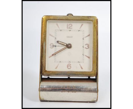 A vintage 1930's Art Deco Jaeger&nbsp;le Coultre travel alarm clock in folding white metal case with good face, faceted hands