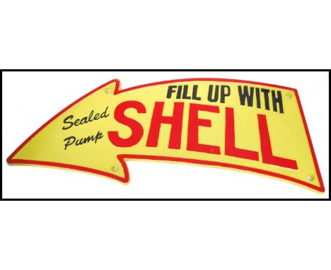 A vintage style painted cast iron advertising point of sale garage sign for Shell with notation reading Fill Up With Shell Se