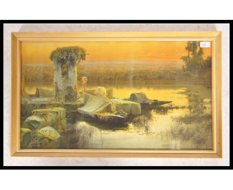 After Enrique Serra. A 20th century retro lake scene print with ruins etc in the Roma style being framed and signed to the co