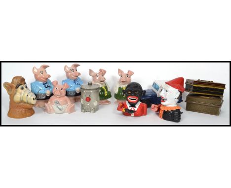 A collection of vintage 20th century money boxes to include cast metal, Dusty Bin, A.L.F, Natwest pigs etc please refer to im