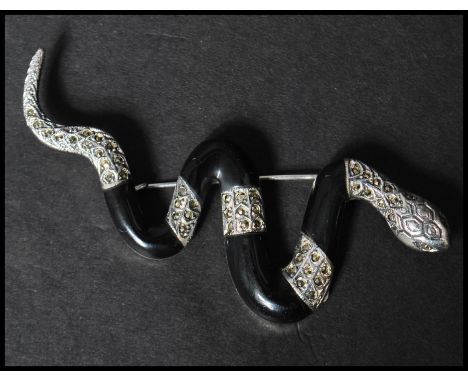 A 925 silver figural brooch in the form of&nbsp; a snake set with marcasite having a roller clip clasp. Measures 8.5cms.