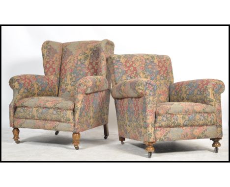 A pair of Victorian Chesterfield armchairs. Matching ladies and gentleman's chairs, one being a wingback, the other of lower 