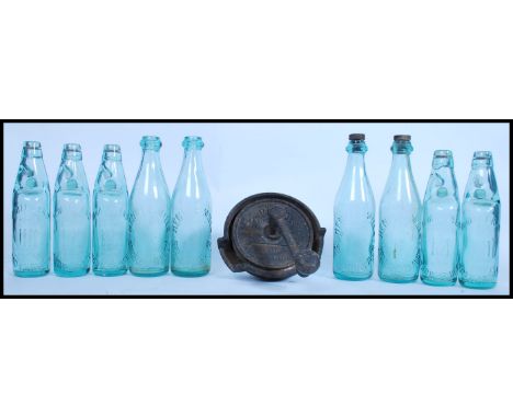 A collection of good clean coloured blue glass ( light ) lemonade bottles with the marbles intact with notation for Millard o