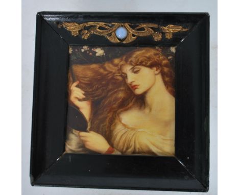 An unusual framed Art Nouveau style metal tile having a portrait study of a young lady being set within an ebonised frame. Th
