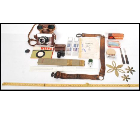 A dealers lot to include vintage leather scout badge, Werna SLR camera, vintage measures and rules, Monocular by Wray of Lond