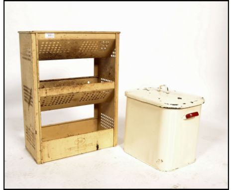 A stunning vintage mid 20th century enamel Tala three tier vegetable rack together with a vintage enamel bread bin on white g