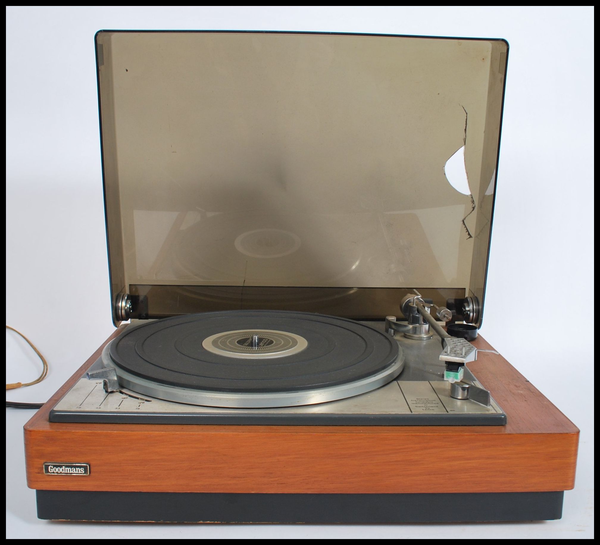 A vintage 20th century Lenco Goldring record player deck set within a teak wood Goodmans case wit