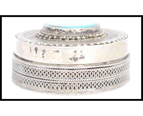 A vintage 20th century Kazakhstan silver gilt and Turquoise snuff box from Russian central Asia of circular form, fitted with