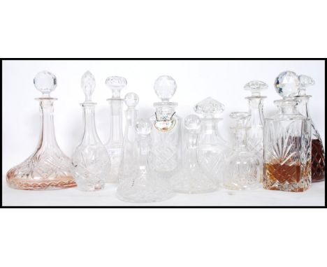 A good collection of vintage early and later 20th century cut glass lead decanters to include a stunning ships decanter all f