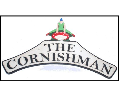 A vintage style cast metal sign in the manner of Warboys for The Cornishman wall plaque, the plaque of white ground with blac