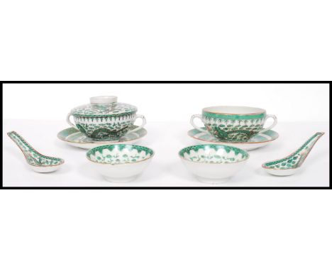 A vintage 20th century Chinese ceramic rice set consisting of rice bowls and cover, side plates spoon etc. The items having a