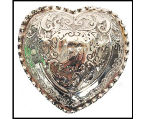 A silver Edwardian hallmarked Rococo heart shaped trinket pot with fitted&nbsp; hinged lid. Birmingham assay dating to 1911 a