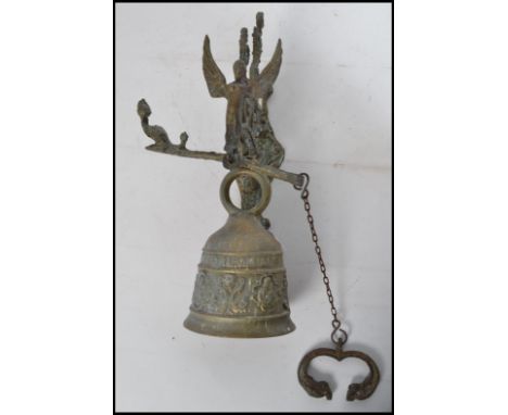 A cast brass wall bell Renaissance Revival style cast brass wall bell decorated with a band of acanthus scrolls and quatrefoi