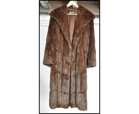 A vintage mid 20th century ladies dark mink coat, retailed by Harrods The three quarter length mink with a short lapel and fu