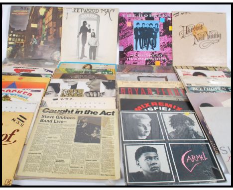 Vinyl Records - A collection of vinyl long play LP record albums to include various artists such as Neil Young, The Hollies, 