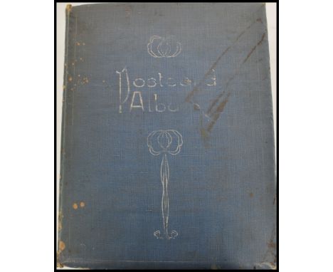 An early 20th century Edwardian postcard album with contents, approximately 170 postcards within to include local vistas, car
