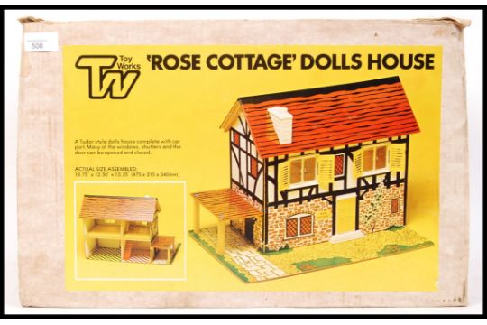 A Vintage Toy Works Made Wooden Tudor Style Rose Cottage Dolls