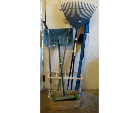 A manual lawn scarifier together with snow shovel, garden rake, hose, rake and two fishing rods including a fly rod