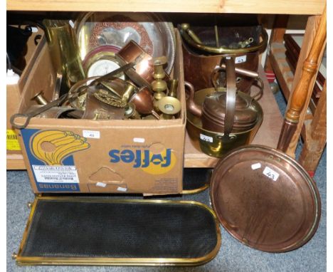 A box of brass and copper ware including a barometer, shell case, horse brasses, candlesticks etc. together with copper and b
