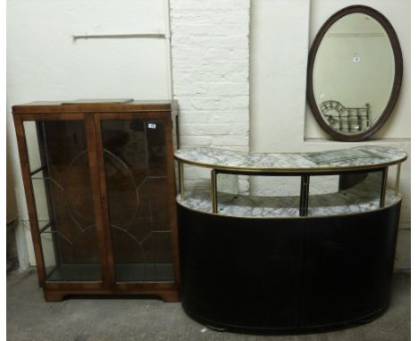 A 1970's bar unit of curving form with black fabric covered front and simulated marble two-tier top with mirrored dividers, 1