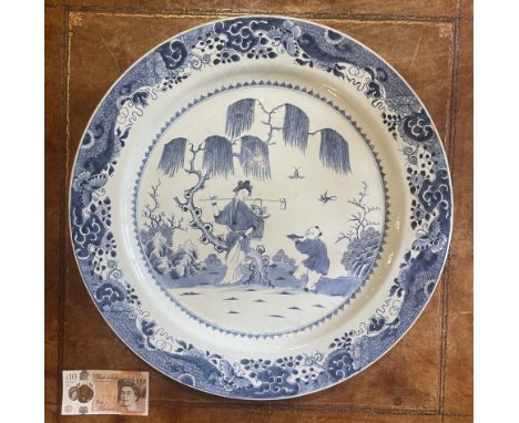 A large blue and white charger, Qing Dynasty, Qianlong (1736 - 95)
55.7cm wide
Condition
The charger is in overall good condi