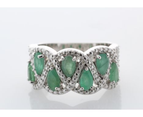 Sterling silver emerald ring, set with seven pear shaped emeralds. Seven pear shaped 5mm x 3mm emeralds. Item Specifications: