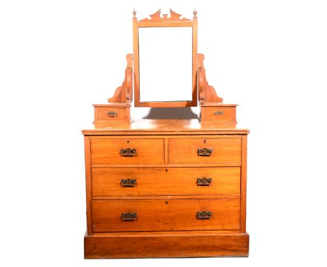 A Victorian walnut dressing table, rectangular bevelled mirror, shaped supports above trinket drawers, with two short and two