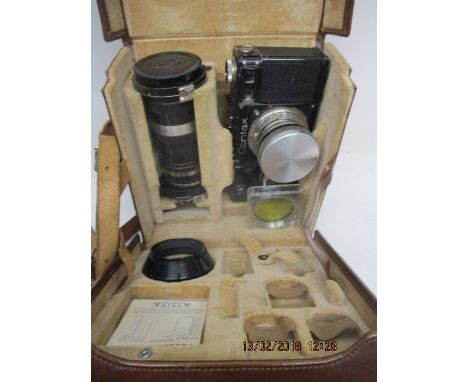 A Zeiss Ikon Contax camera with a sennar 1:2 f=5cm lens no 1548357, a Sonnar 1:4f=13, 5cm lens no 1459688, two filters and a 