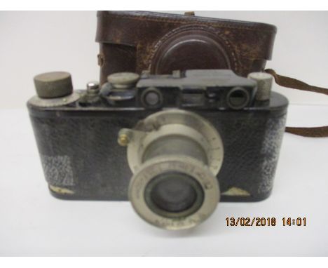 A 1928 Leica 1 camera with an Elmar 1:35 F - 50mm lens no 86106 in a stitched leather case 