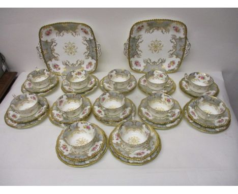 A Coalport china teaset decorated with sprigs of flowers, grey panels and gilt ornament comprising twelve cups, twelve saucer