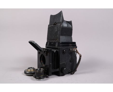 A Thornton Pickard Ruby Horizontal SLR Body with Unrelated Lenses, 6.5 x 9cm format, body F-G, a number of small holes in fro