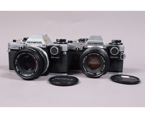 Two Olympus OM 10 SLR Cameras, both shutters working, meters responsive, self timers working, both with manual adapters, bodi