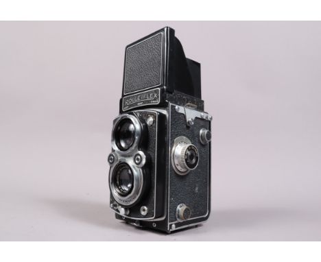 A Rolleiflex Automat TLR Camera, model III, serial no 1064757, shutter working, body G, some wear to leatherette, with Schnei