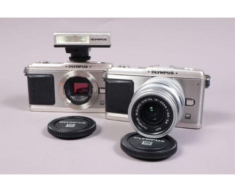 An Olympus Pen E-P1 Digital Camera and E-P1 Body both power up, shutters working, otherwise untested, bodies VG, one unboxed 