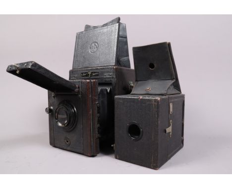 A Thornton Pickard Junior Special SLR Plate Camera, ¼ plate format, body F, focusing rack action smooth, hood leather G, mirr