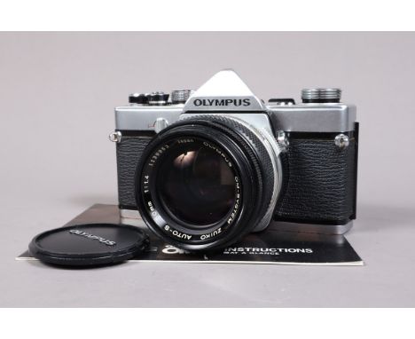 An Olympus OM 1 SLR Camera, serail no 171101, shutter working, meter responsive, self timer working, body G, slight marks, ti