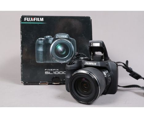 A Fujifilm Finepix SL1000 Digital Bridge Camera, serial no 3TL02332, with maker's box, a battery, no card, carrying strap and