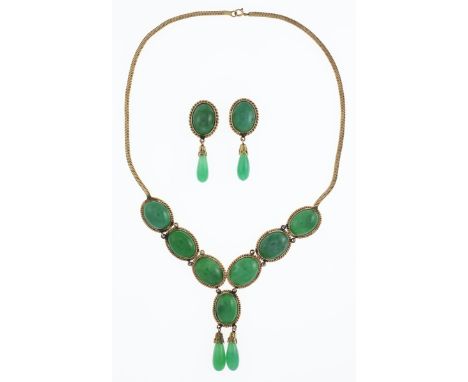 Jade Necklace and Clip Earrings. Necklace has seven oval cabochon, with two hanging pendants. Each encased in braided metal. 