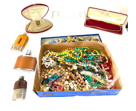 Selection of assorted costume jewellery includes beads, brooches, rings etc 