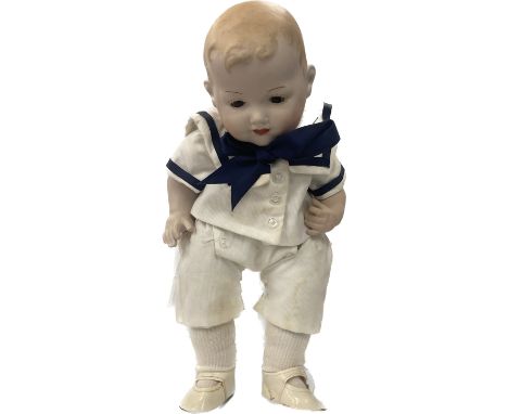 A vintage A.M germany pot doll on stand 