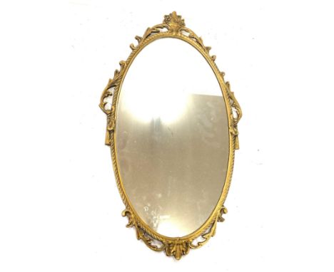 Vintage gilt framed mirror measures 14 inches tall 7 inches wide