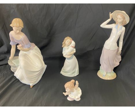 Selection of Nao pottery figures includes spring reflections figure etc 