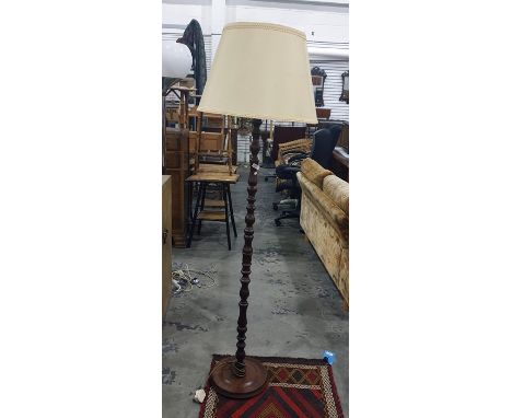 Turned mahogany standard lamp with cream shade 