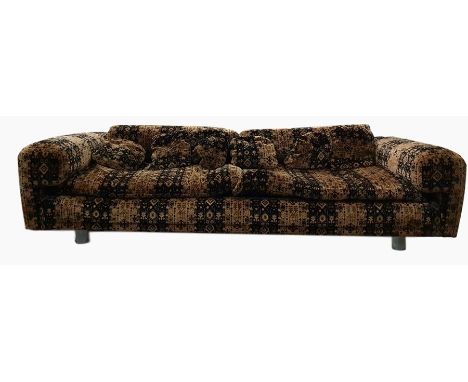 Howard Keith 1970's 'Diplomat' sofa upholstered in brown and black, raised upon cylindrical chrome supports Overall fair, lit