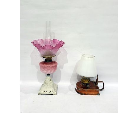 Copper carrying oil lamp with brass fitting and another oil lamp with pink frill rim shade, opaque pink moulded reservoir, on