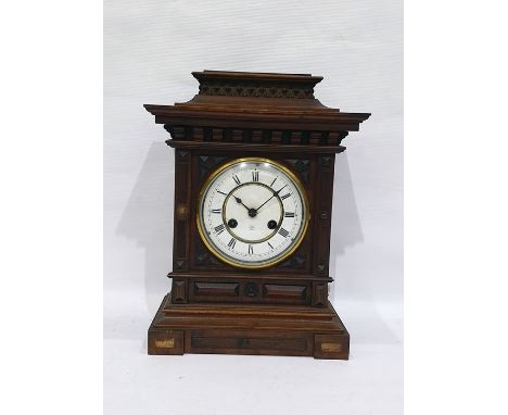 Early 20th century eight-day mantel clock by Junghans, the circular enamel dial with Roman numerals and in architectural waln