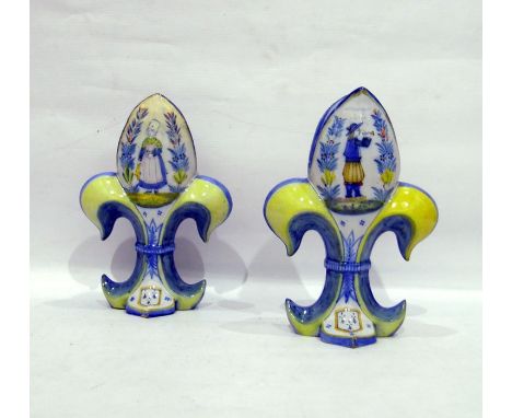 Pair of H R Quimper 'Fleur De Lys' shaped vases, each decorated with Petit Breton of male playing bombarde and the other Peti