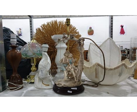 Three lamps together with white ceramic pedestal, figure of boy and girl on swing, etc