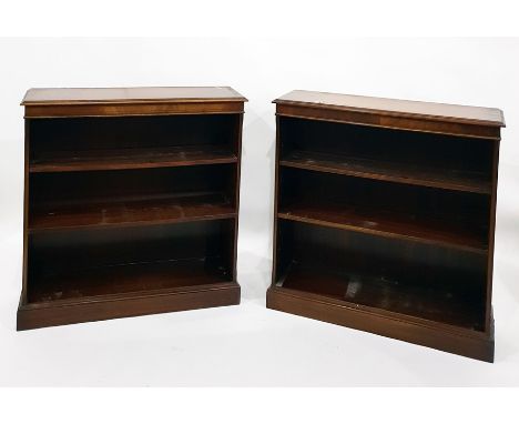 Two 20th century mahogany open bookcases to plinth bases (2) They measure 90 wide x 30 deep and 92 cms height . There is blue