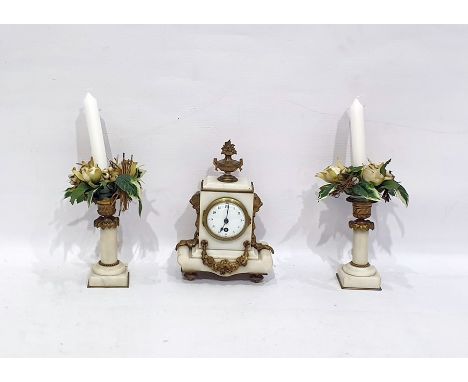 Gilt metal and alabaster clock garniture, the clock with urn finial, pair lion masks to the side, floral swag below the ename